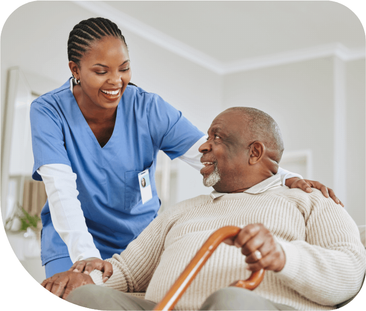 A carer supporting an older man at home