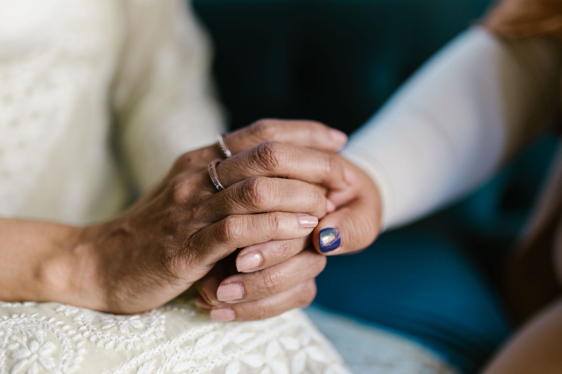 Two people holding hands